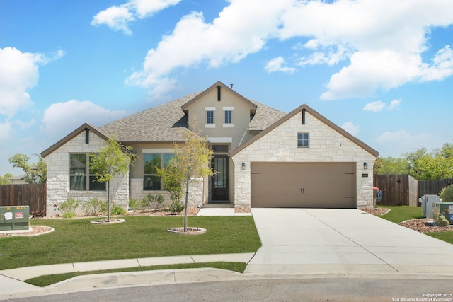 view of front facade featuring a front lawn, fence, stone siding, and driveway