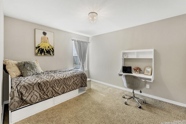 carpeted bedroom featuring baseboards