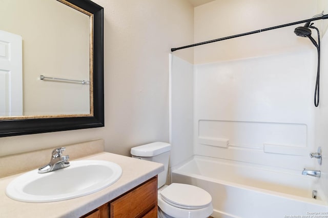 bathroom with shower / bathtub combination, toilet, and vanity