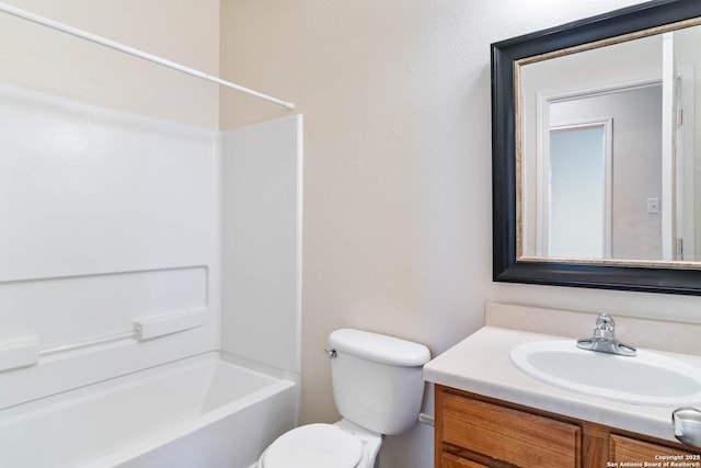 full bathroom featuring shower / bathing tub combination, toilet, and vanity