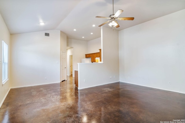 unfurnished living room featuring visible vents, lofted ceiling, baseboards, and finished concrete flooring