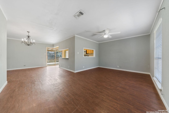 empty room featuring wood finished floors, visible vents, baseboards, ornamental molding, and ceiling fan with notable chandelier