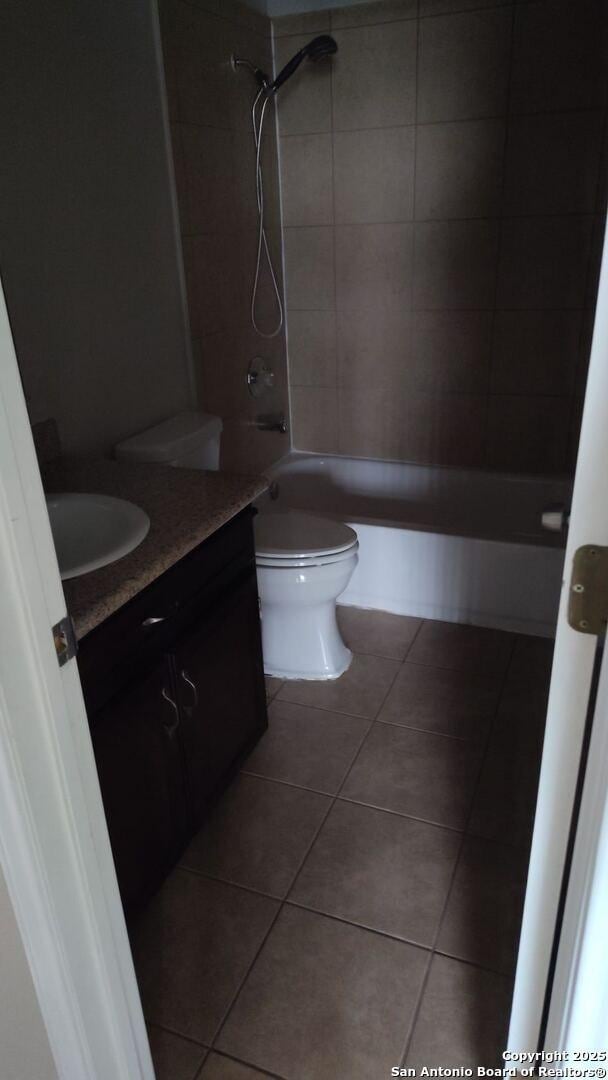 full bathroom with toilet, shower / washtub combination, vanity, and tile patterned flooring