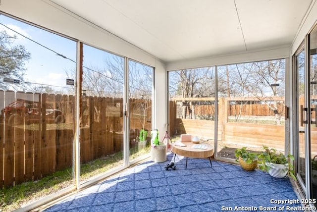 unfurnished sunroom with a healthy amount of sunlight