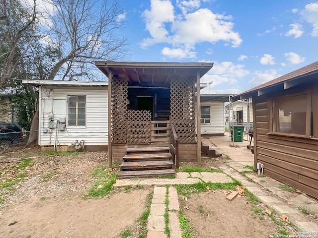 view of front of home featuring fence