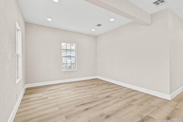 unfurnished room featuring recessed lighting, visible vents, and light wood-style flooring