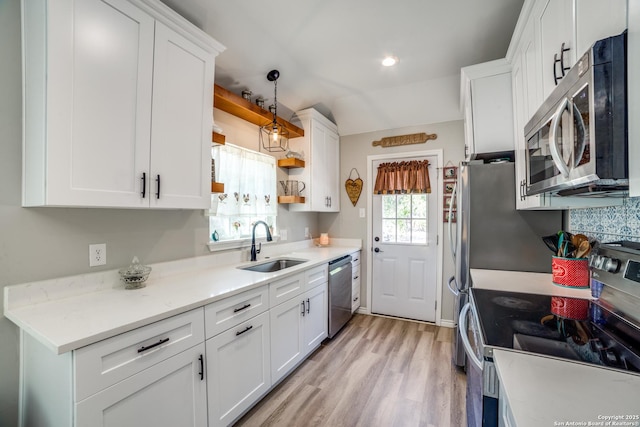 kitchen featuring white cabinetry and stainless steel appliances