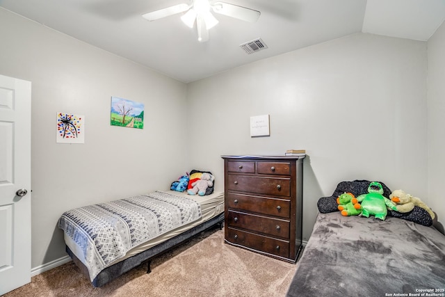 bedroom with visible vents, lofted ceiling, carpet, and a ceiling fan