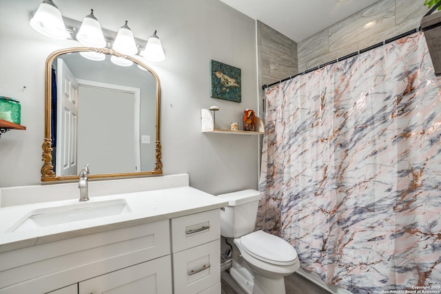 full bathroom with a shower with shower curtain, toilet, and vanity