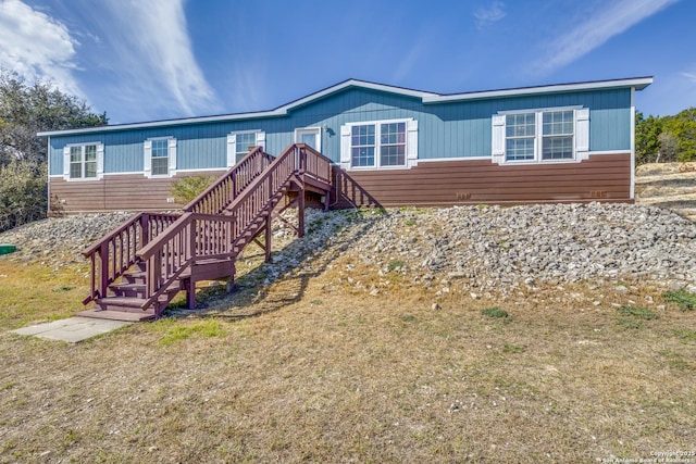 view of front of home featuring stairs