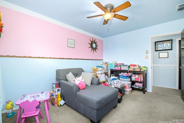 playroom featuring visible vents, a ceiling fan, and carpet