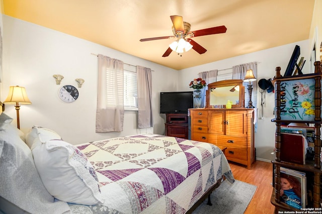 bedroom featuring ceiling fan and wood finished floors