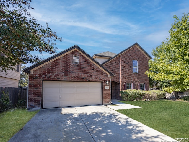 traditional home with a front yard, an attached garage, brick siding, and driveway