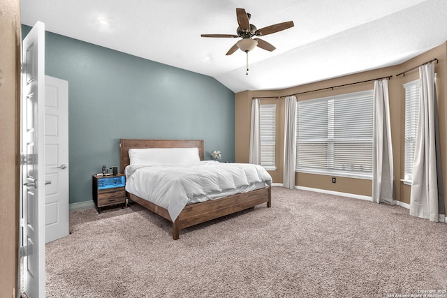 carpeted bedroom featuring baseboards, a ceiling fan, and vaulted ceiling