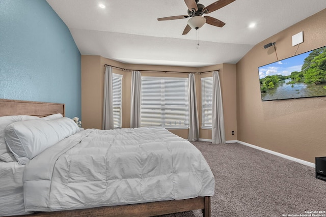 bedroom featuring baseboards, lofted ceiling, carpet, and a textured wall