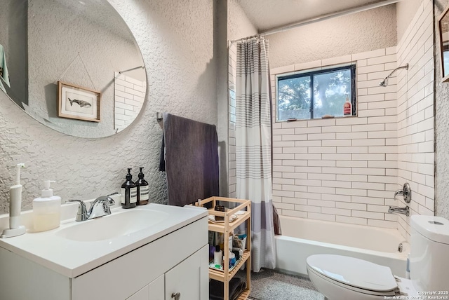 full bath with shower / bathtub combination with curtain, toilet, vanity, and a textured wall