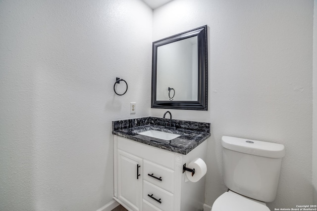 half bath with toilet and vanity