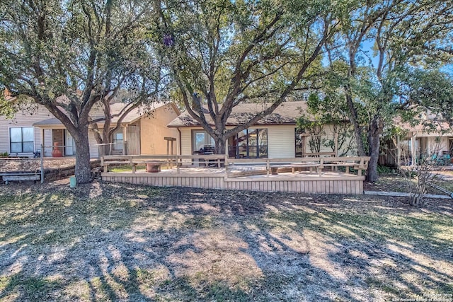 view of front of property featuring a deck