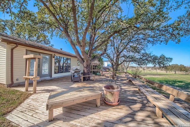 wooden terrace featuring area for grilling