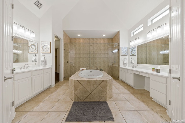 full bath featuring a sink, visible vents, a garden tub, and tile patterned flooring