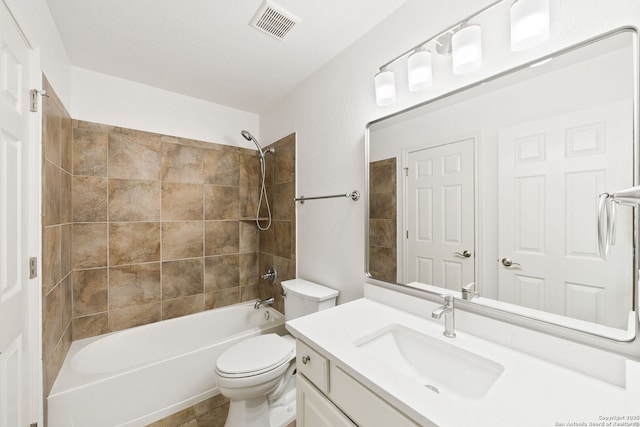 bathroom featuring visible vents, toilet, washtub / shower combination, and vanity