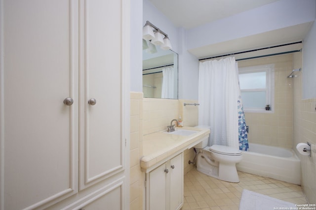 bathroom with tile walls, toilet, shower / bath combo, tile patterned floors, and vanity