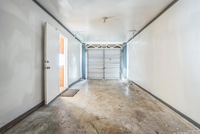 garage featuring baseboards