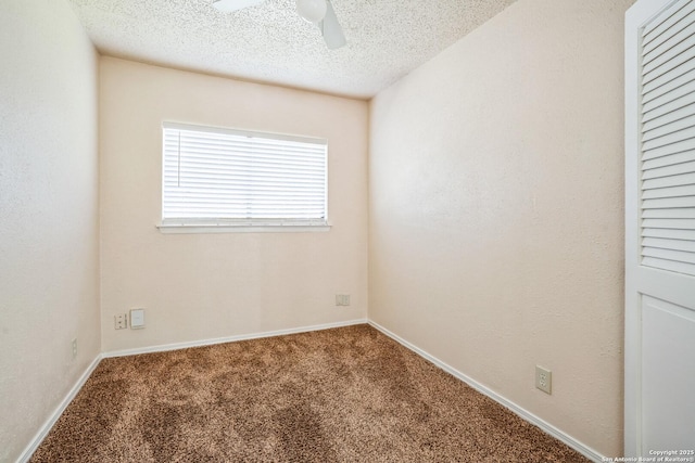 carpeted empty room with baseboards, a textured ceiling, a ceiling fan, and a textured wall