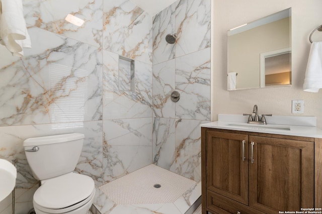 full bath featuring a marble finish shower, toilet, and vanity