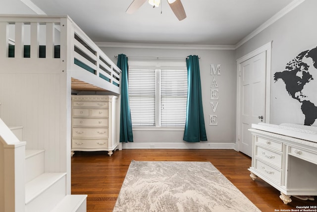 bedroom with ceiling fan, baseboards, dark wood finished floors, and crown molding