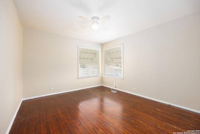 empty room featuring baseboards, wood-type flooring, and ceiling fan