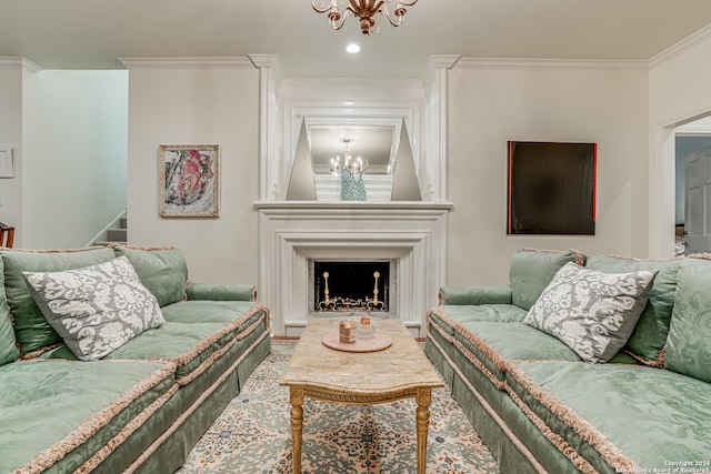 living room with stairs, a large fireplace, an inviting chandelier, and crown molding