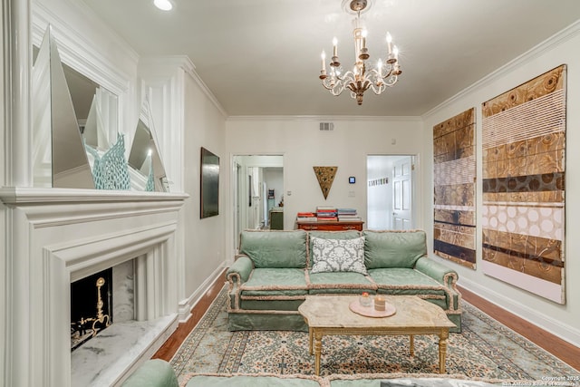 living room with visible vents, ornamental molding, and a fireplace