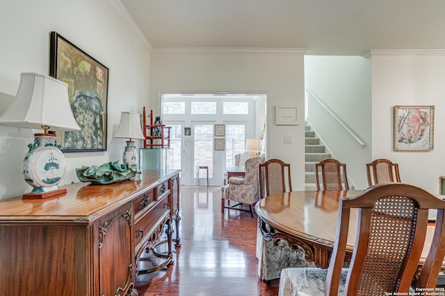 dining area with stairs, dark wood finished floors, and crown molding