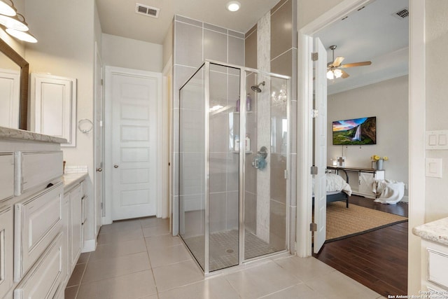 3234 Lilly Flower, San Antonio, TX 78253 - ensuite bathroom with vanity, a stall shower, ensuite bath, a ceiling fan, and visible vents