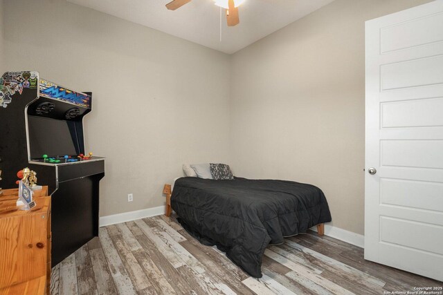 3234 Lilly Flower, San Antonio, TX 78253 - bedroom featuring baseboards, a ceiling fan, and wood finished floors