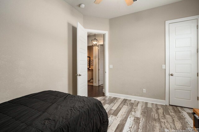3234 Lilly Flower, San Antonio, TX 78253 - bedroom with ceiling fan, baseboards, and wood finished floors