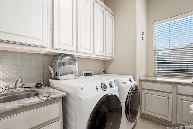 3234 Lilly Flower, San Antonio, TX 78253 - laundry room with washing machine and dryer, a sink, and cabinet space