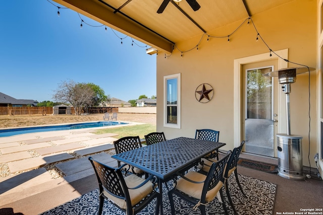 3234 Lilly Flower, San Antonio, TX 78253 - view of patio with a ceiling fan, a fenced backyard, a fenced in pool, and outdoor dining area
