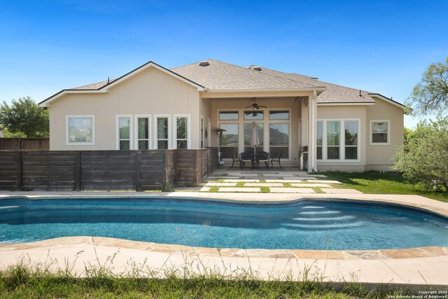 3234 Lilly Flower, San Antonio, TX 78253 - back of house with ceiling fan, stucco siding, a patio area, fence, and a fenced in pool