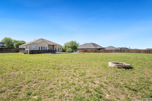 3234 Lilly Flower, San Antonio, TX 78253 - view of yard featuring a fenced backyard and an outdoor fire pit