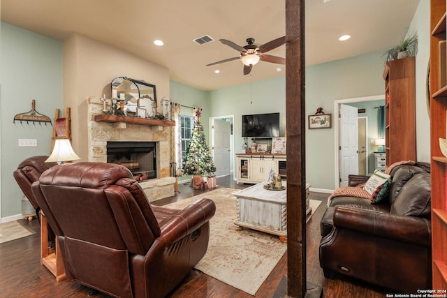 living room with visible vents, recessed lighting, a fireplace, dark wood-style flooring, and ceiling fan