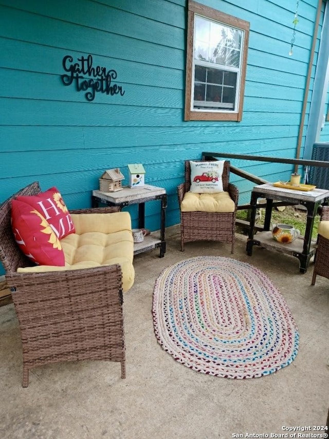 balcony with a patio area and an outdoor living space