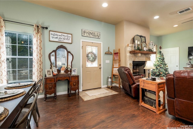 interior space with visible vents, wood finished floors, and a fireplace