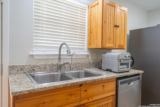 kitchen featuring a sink, a toaster, and stainless steel appliances