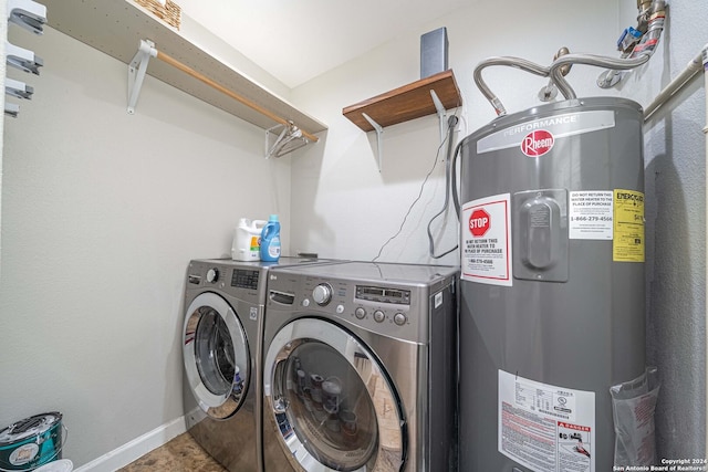 laundry room featuring laundry area, washer and dryer, electric water heater, and baseboards