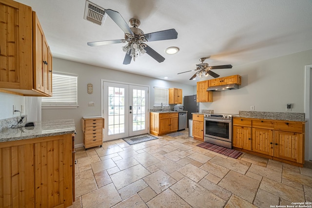 kitchen with stone tile floors, visible vents, stainless steel appliances, french doors, and under cabinet range hood