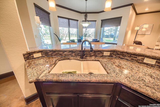 details with a sink and light stone countertops