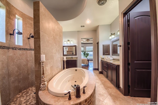 full bathroom featuring tile patterned floors, visible vents, a walk in shower, a whirlpool tub, and vanity