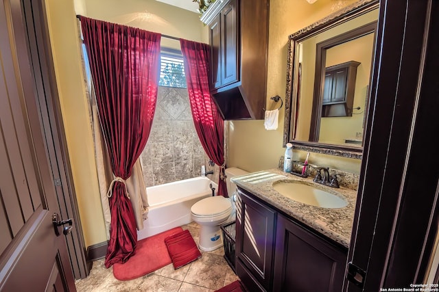 full bath featuring toilet, bathtub / shower combination, vanity, and tile patterned flooring